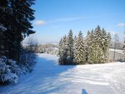Het komt voor dat de onderste helling door sneeuwgebrek niet geprepareerd kan worden.