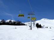 Sattelbahn - 4-persoons hogesnelheidsstoeltjeslift (koppelbaar) met kap en stoelverwarming
