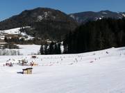 Loopband, sleeplift en schotellift in het dal