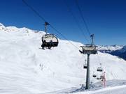 Jonvrai-Clünas - 4-persoons hogesnelheidsstoeltjeslift (koppelbaar) met kap