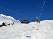 Trattenbach - 6-persoons hogesnelheidsstoeltjeslift (koppelbaar) met kap en stoelverwarming