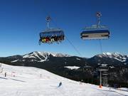 Kapellenbahn - 8-persoons hogesnelheidsstoeltjeslift (koppelbaar) met kap en stoelverwarming