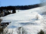 Glooiende afdaling bij de Scheuermattlift