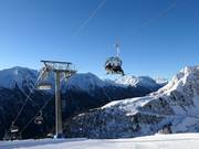 Alblittkopfbahn - 4-persoons hogesnelheidsstoeltjeslift (koppelbaar) met kap