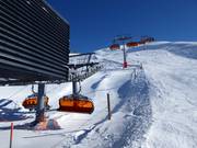 Sonnen Bahn (Gampabing) - 8-persoons hogesnelheidsstoeltjeslift (koppelbaar) met kap en stoelverwarming