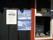 Kleine pistekaart bij de kassa's