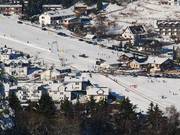 Dichte bebouwing rond de Sonnenhang. Veel van de huizen bieden vakantiewoningen aan.