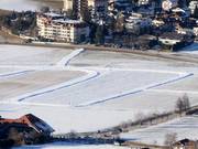 Besneeuwde loipes in Reischach