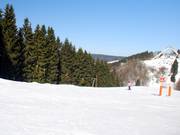 Kort, breed en meestal leeg: piste bij de Astenstraßenlift