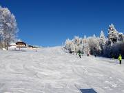 Lichte en brede piste bij de Almwiesenlift