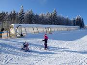 Oefengebied Junior Ski Zirkus met overdekte transportbanden